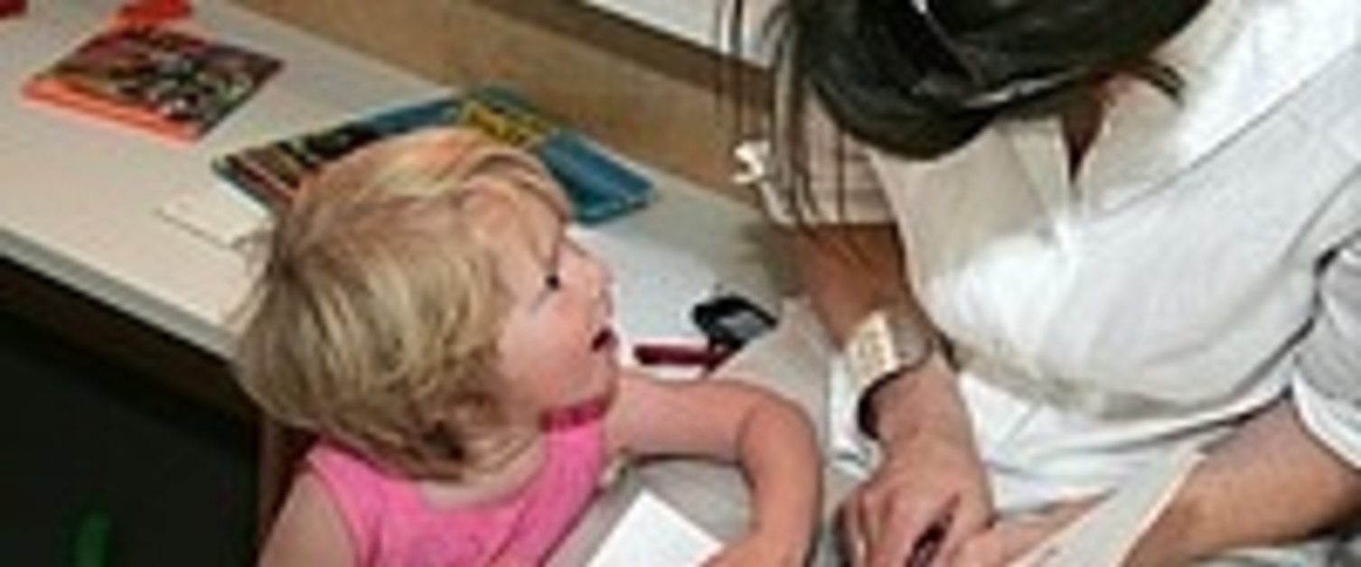 A young girl communicating with her mother