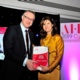 Amanda Atkinson receives the overall winner award from NHS Wales Chief Executive Andrew Goodall. Image credit: John Behets.