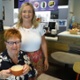 Image shows two people in a cafe.