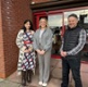 Sowndarya, Emma and Arron stood outside a GP practice