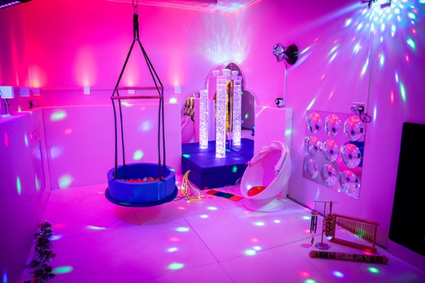The inside of brightly coloured room with lights and toys