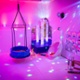 The inside of brightly coloured room with lights and toys