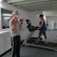 Patients lifting weights and walking on a treadmill