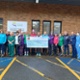 Fitness club members present cheque for vein pen