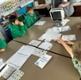 Image shows children looking at a medical device