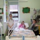 A still picture from a video which shows children playing doctors, patients and a visitor giving a tour of the children