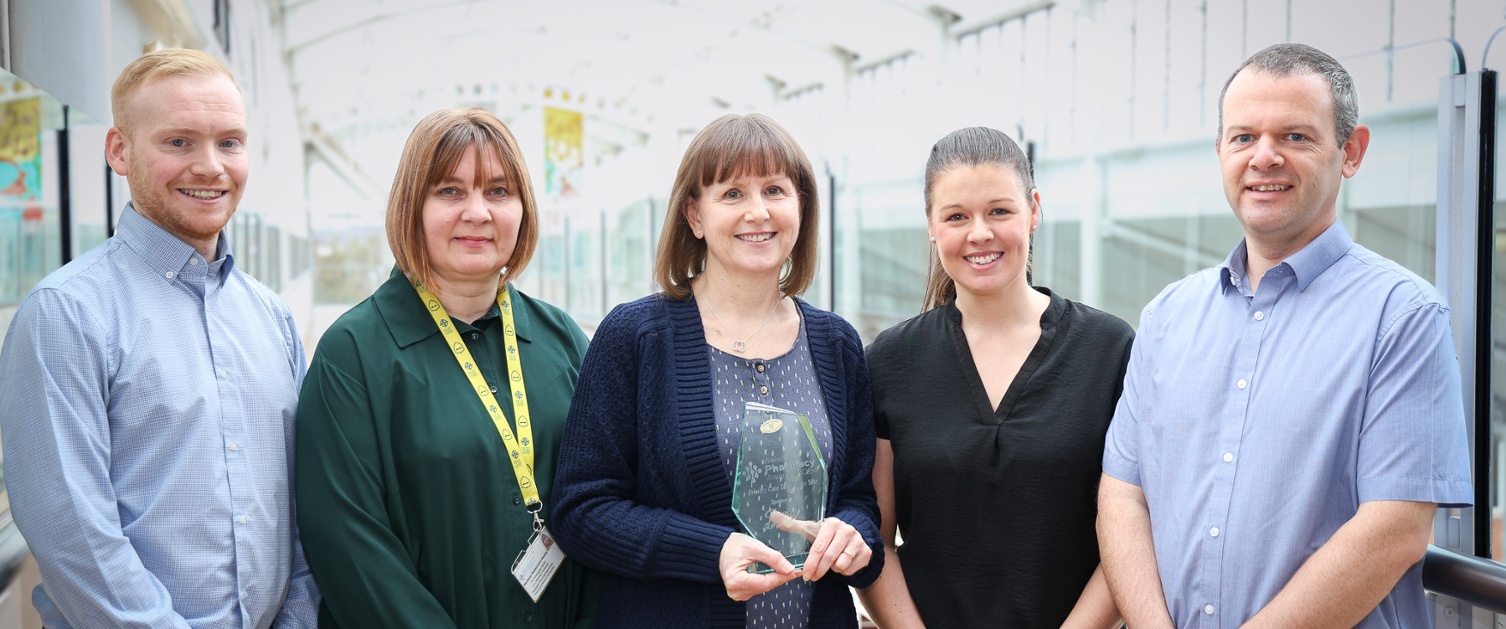 Members of the team with their award