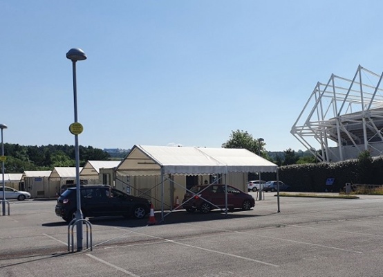 An image of drive-through testing at the Liberty Stadium in Swansea.