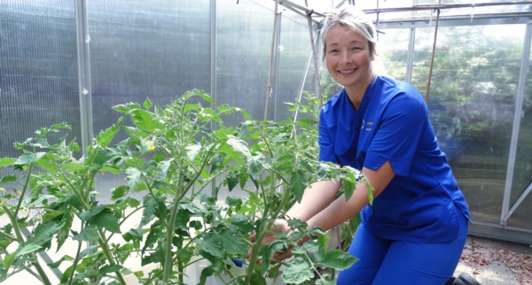 Lisa Davies in the greenhouse