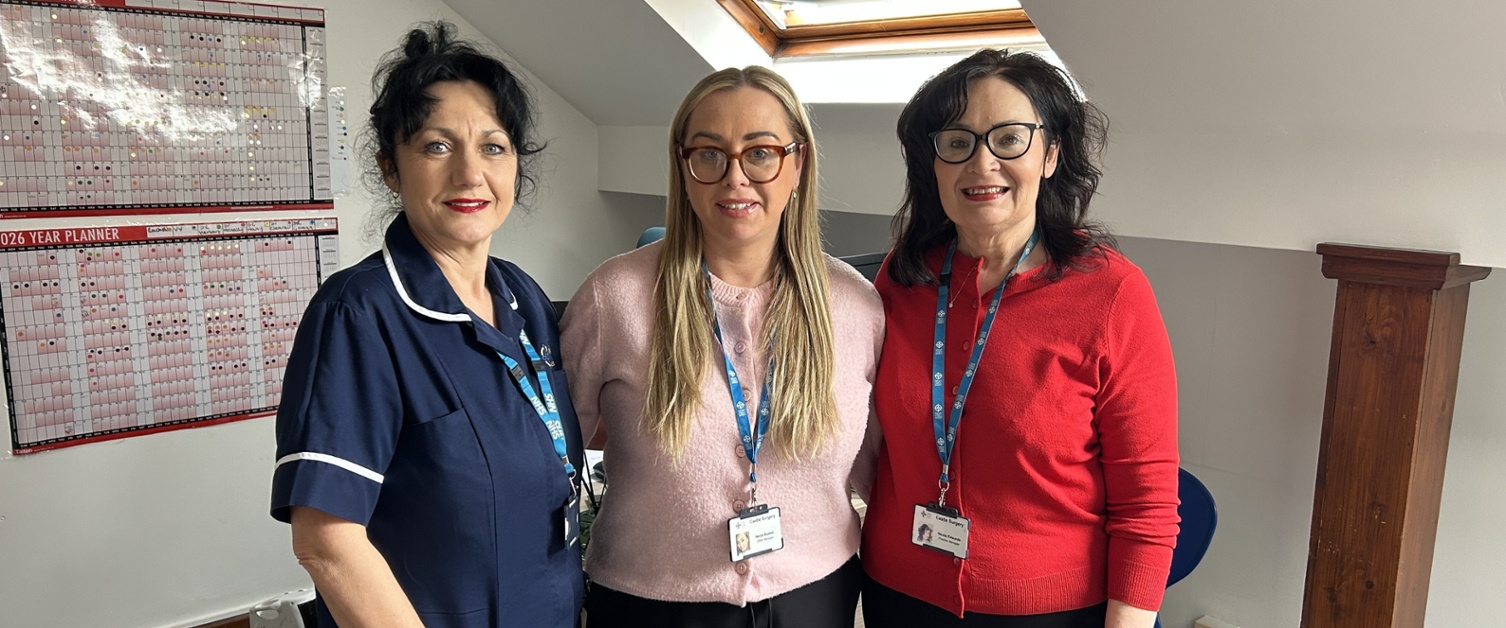 Maria, Nerys and Nicola stood together inside a GP practice