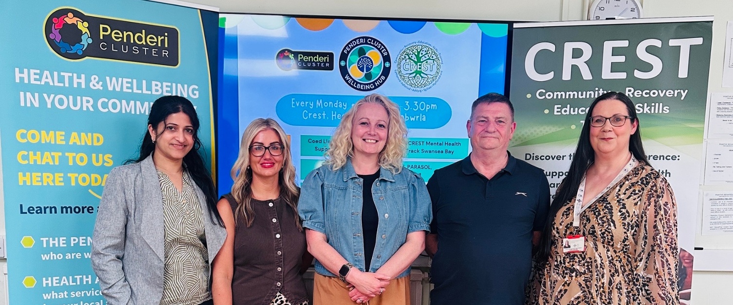 Sowndarya, Sharlene, Alex, Ian and Dawn stood in front of Penderi Cluster and CREST banners