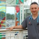 Image shows a nurse in a hospital atrium.