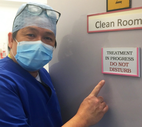 Melvin Cua outside a treatment room