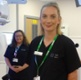 Image shows two radiographers in a radiotherapy treatment room