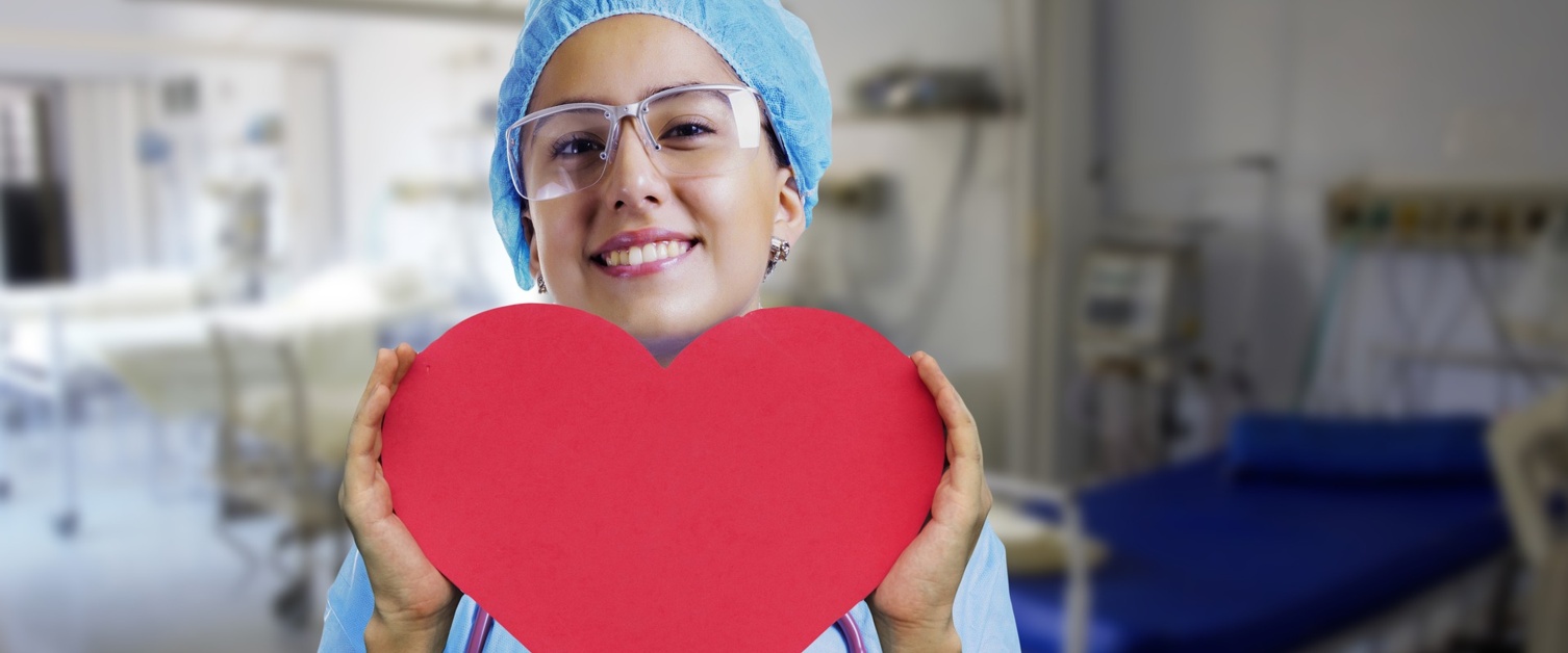 Nurse holding a paper heart cut out