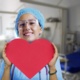 Nurse holding a paper heart cut out