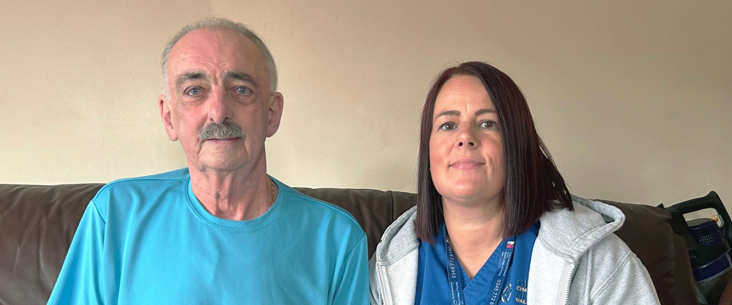 Russell and Louise sat on a sofa