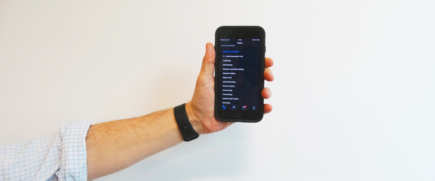 Hand holding phone displaying Consultant Connect