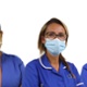 Five staff members in a row face the camera. They wear masks.