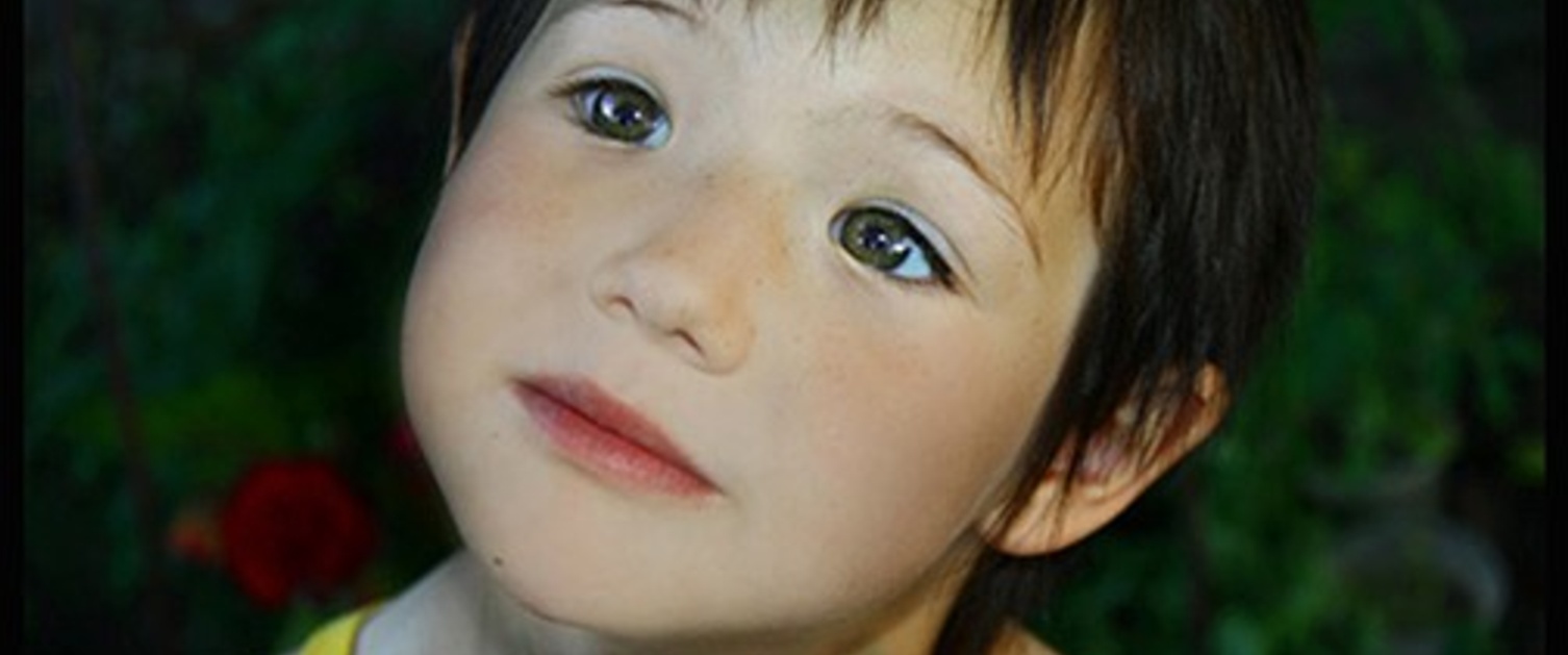 A young boy looking up at the sky