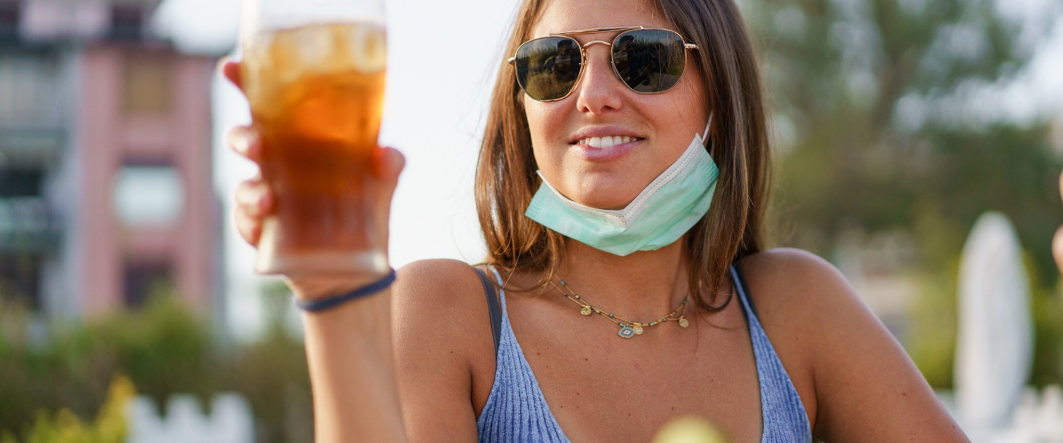 A picture of a woman having a drink