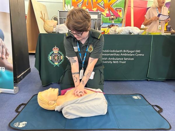 A member of staff demonstrating CPR