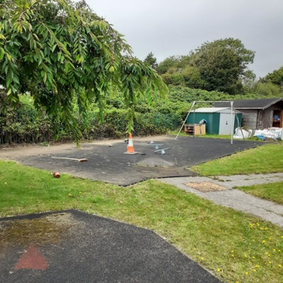 Image shows a disused play area