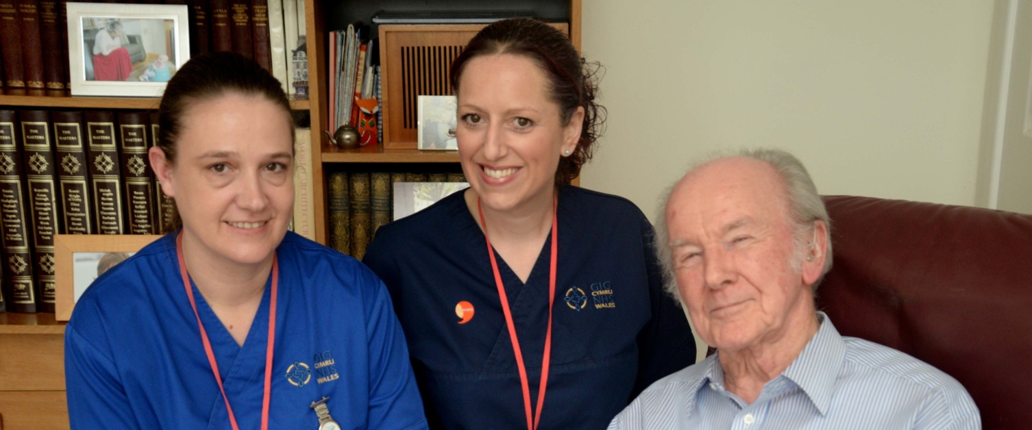 Members of the acute clinical team care for a patient at home.