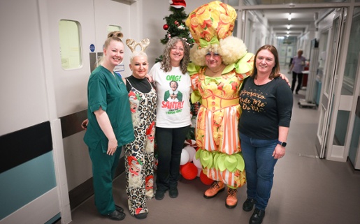 Kev in costume with staff from the Cancer Centre