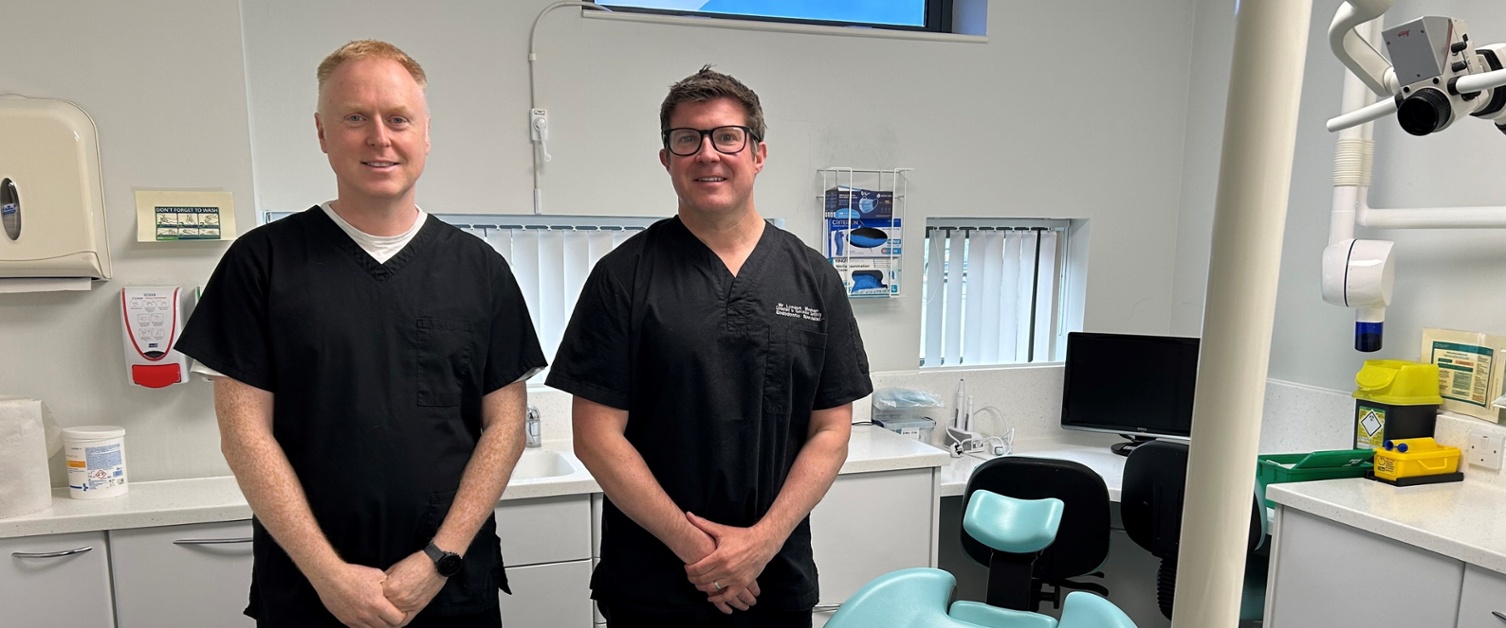 Richard and Lyndon stood next to dental equipment