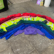 An image of a rainbow created by NHS uniforms