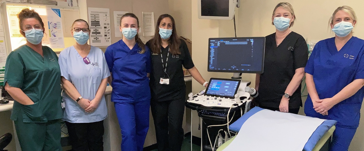 A group of hospital staff inside an ultrasound room