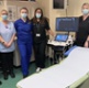 A group of hospital staff inside an ultrasound room