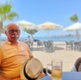 David sat at a beach on holiday