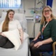 Fiona sat in a hospital bed next to Dr Gillian Ingram