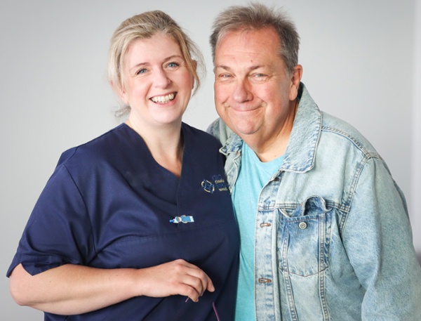 Image shows a nurse with a patient.