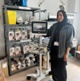 Image shows a woman standing next to medical equipment