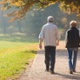 A man and a woman walking in a park