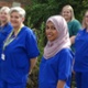 A group of nurses outside a hospital building