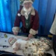 Santa, pictured holding a baby