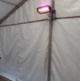 Picture shows a heater attached to the inside of a marquee.