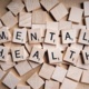 Mental Health written on tiles with tiles in the background.