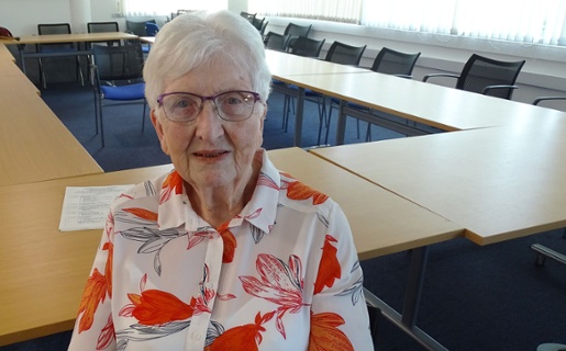 Image shows a woman looking into the camera.