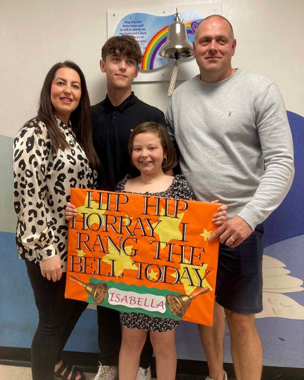 Isabella Minney standing with her mum Julia, brother Oliver and dad Gareth.