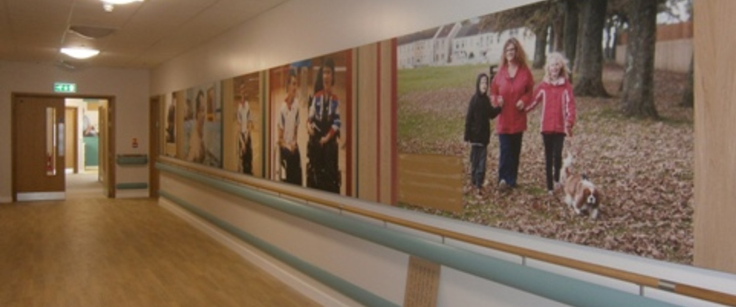 A corridor in the Specialist Rehabilitation Centre with images on the wall.