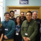 Image shows a group of people in an MRI department.