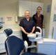 Lois with Elizabeth stood next to a dental chair