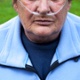 Image shows a patient wearing an oxygen tube in their nose.