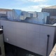 A large building extension, squeezed between two buildings