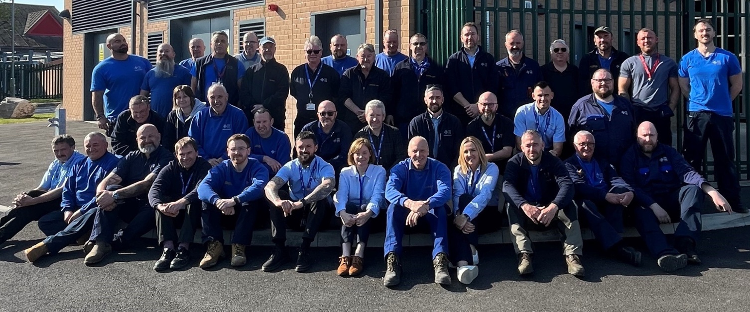 Image shows a large group of staff